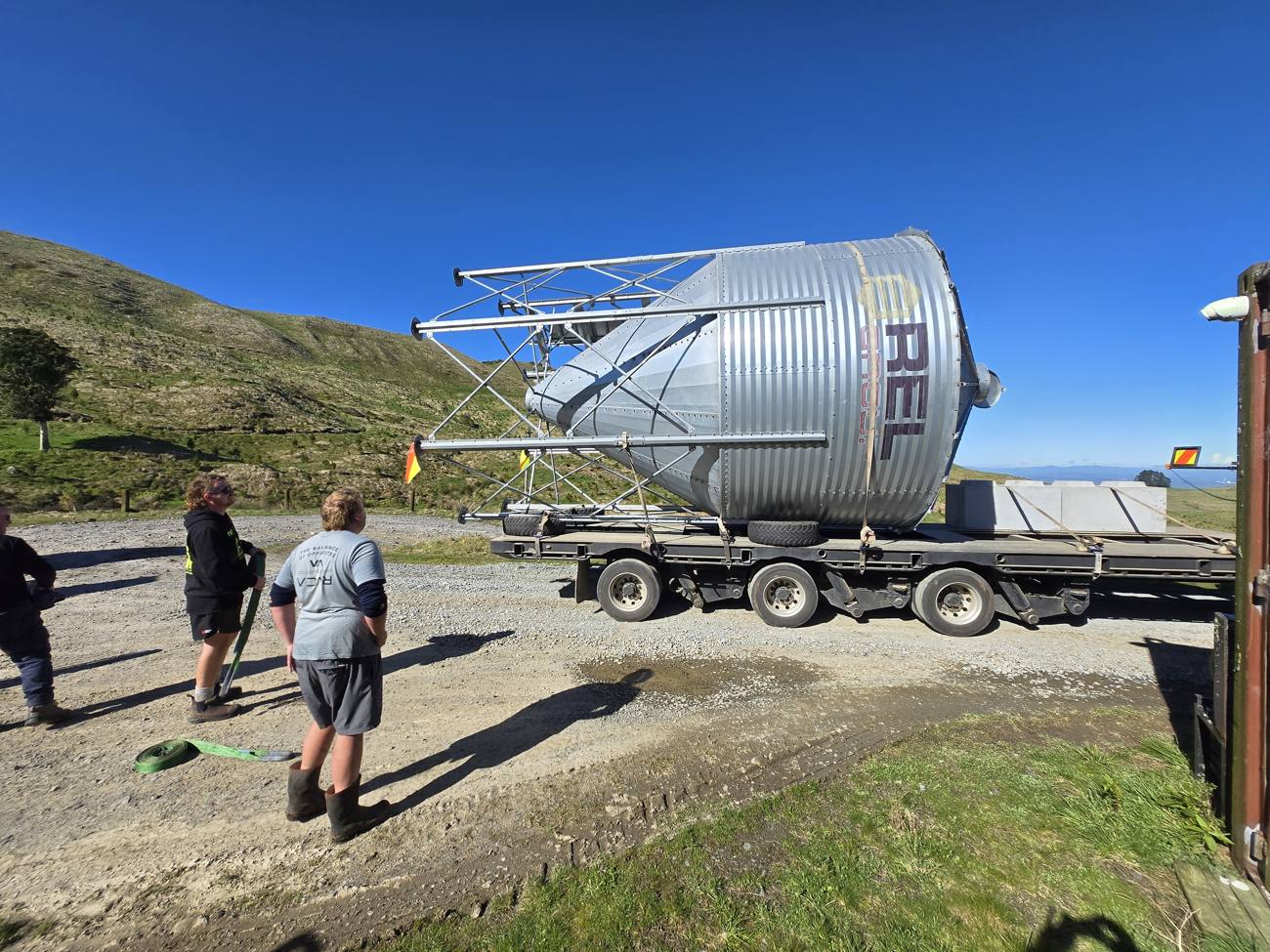The Rawhiti team alongside farm infrastructure